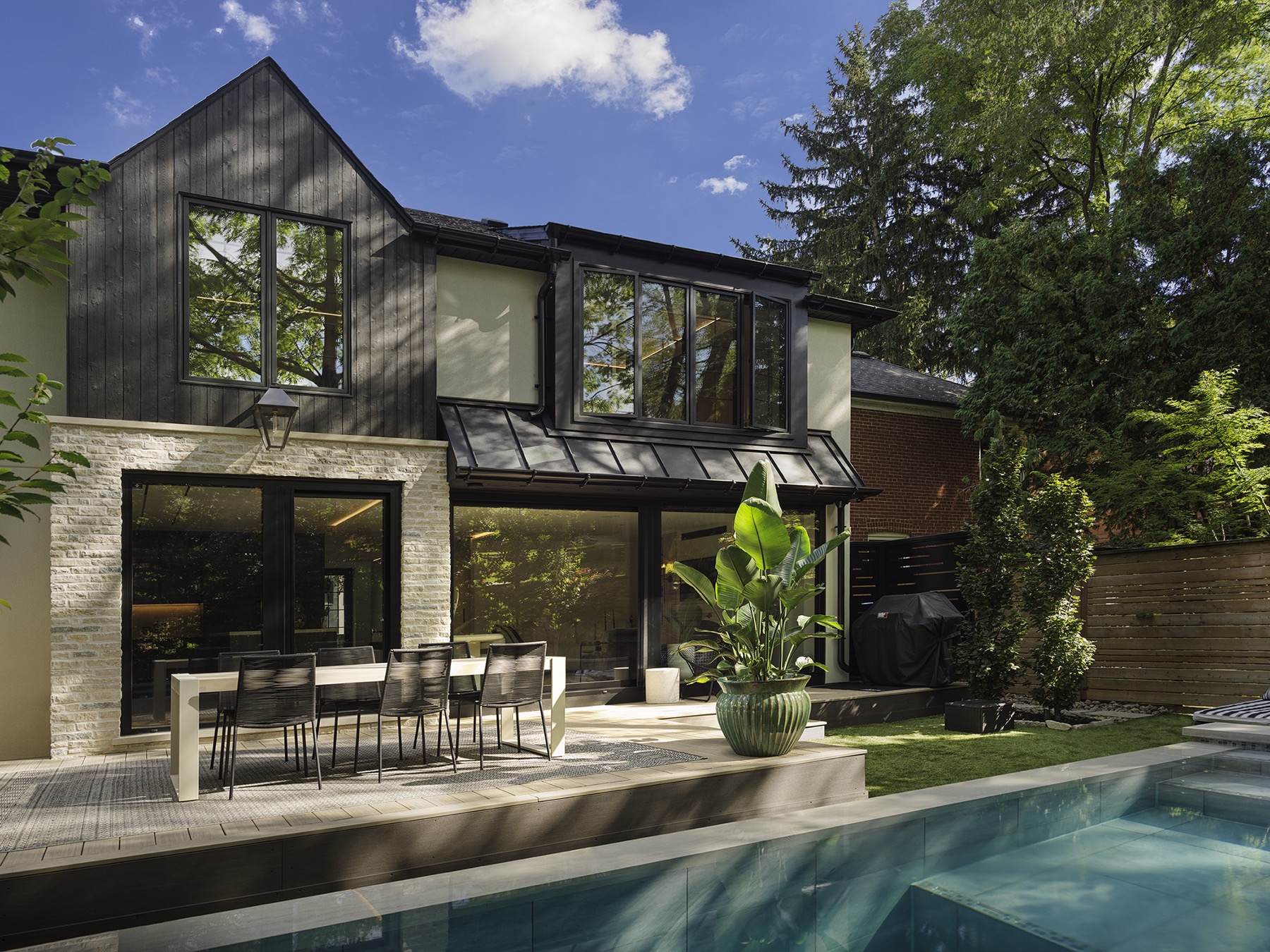Completed Mill Cove garden and pool terrace with integrated lighting and motorized privacy shades